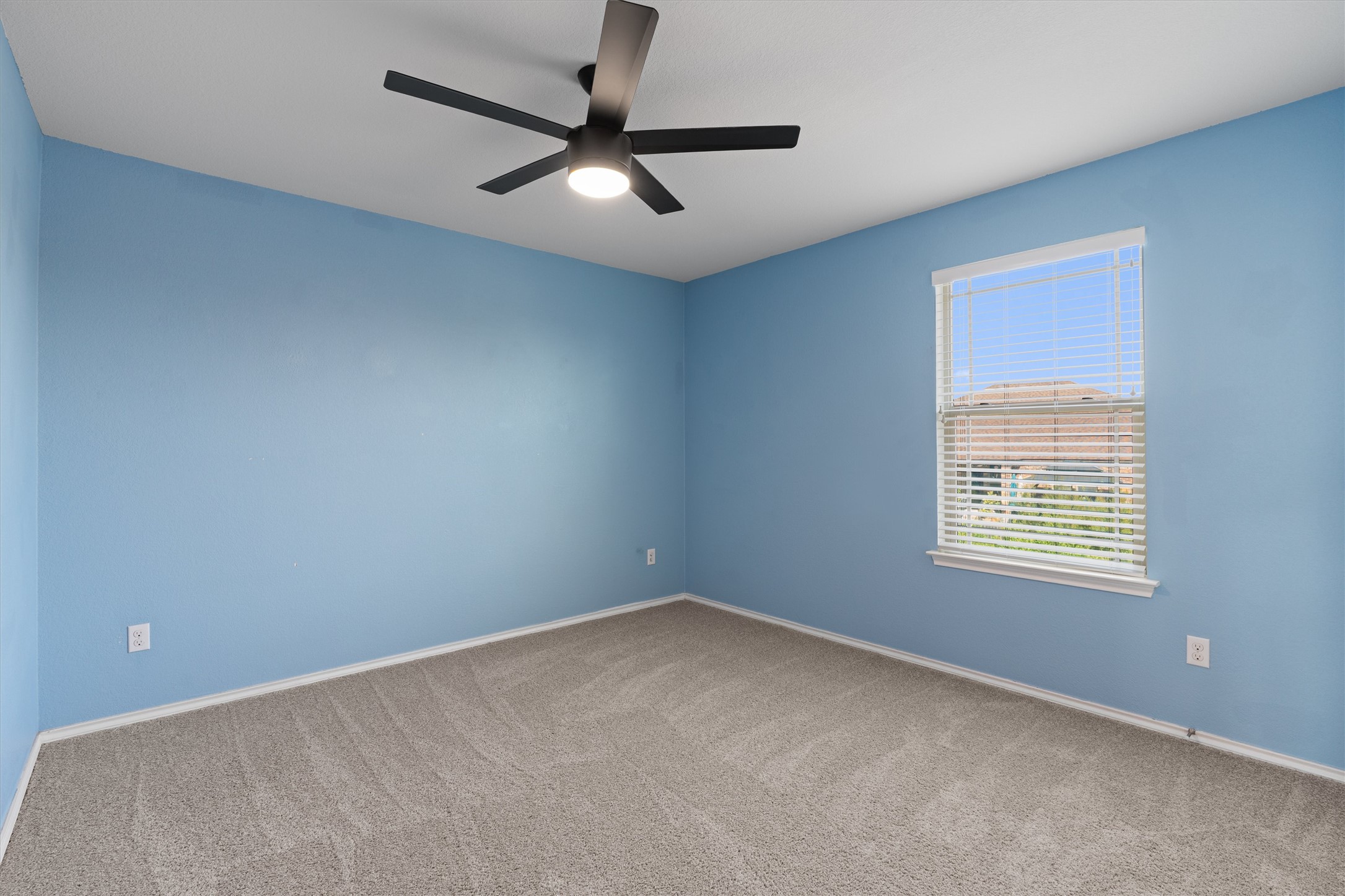 804 Water Hyacinth Loop Leander, TX 78641 - Photo 25 of 37 an empty room with a window and a fan