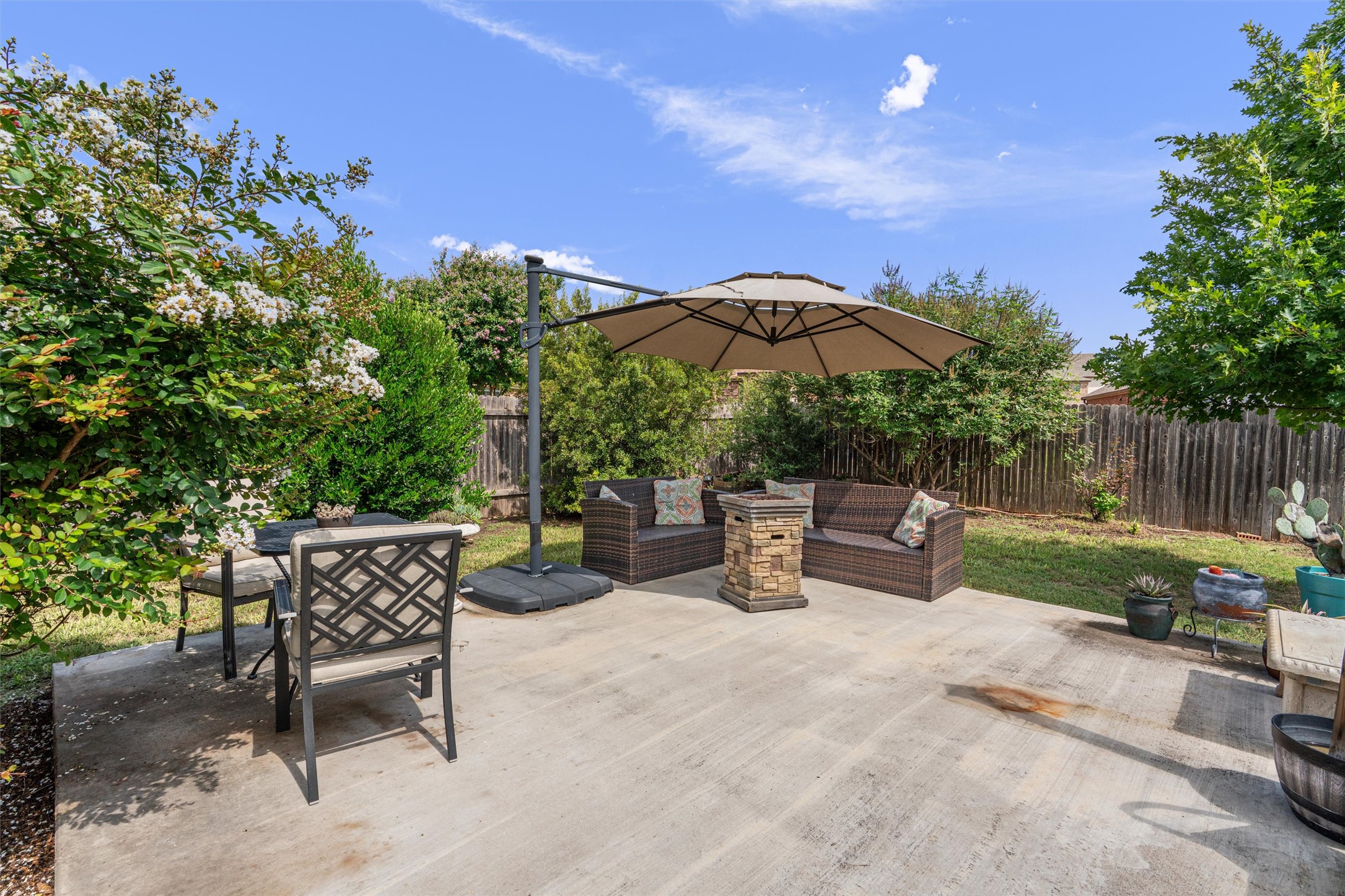 804 Water Hyacinth Loop Leander, TX 78641 - Photo 29 of 37 a view of backyard with outdoor seating and trees