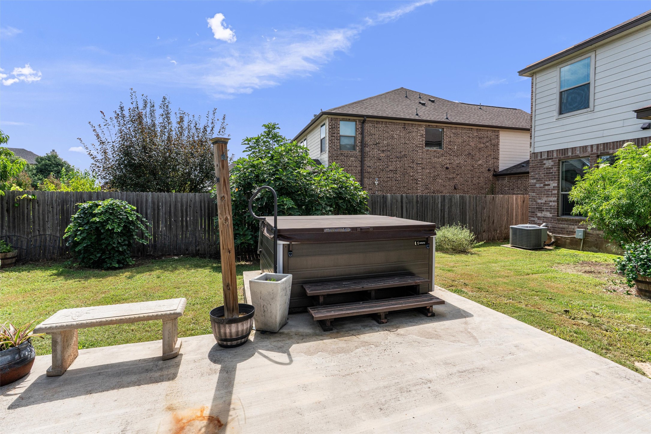 804 Water Hyacinth Loop Leander, TX 78641 - Photo 30 of 37 a view of a back yard of the house with a bench