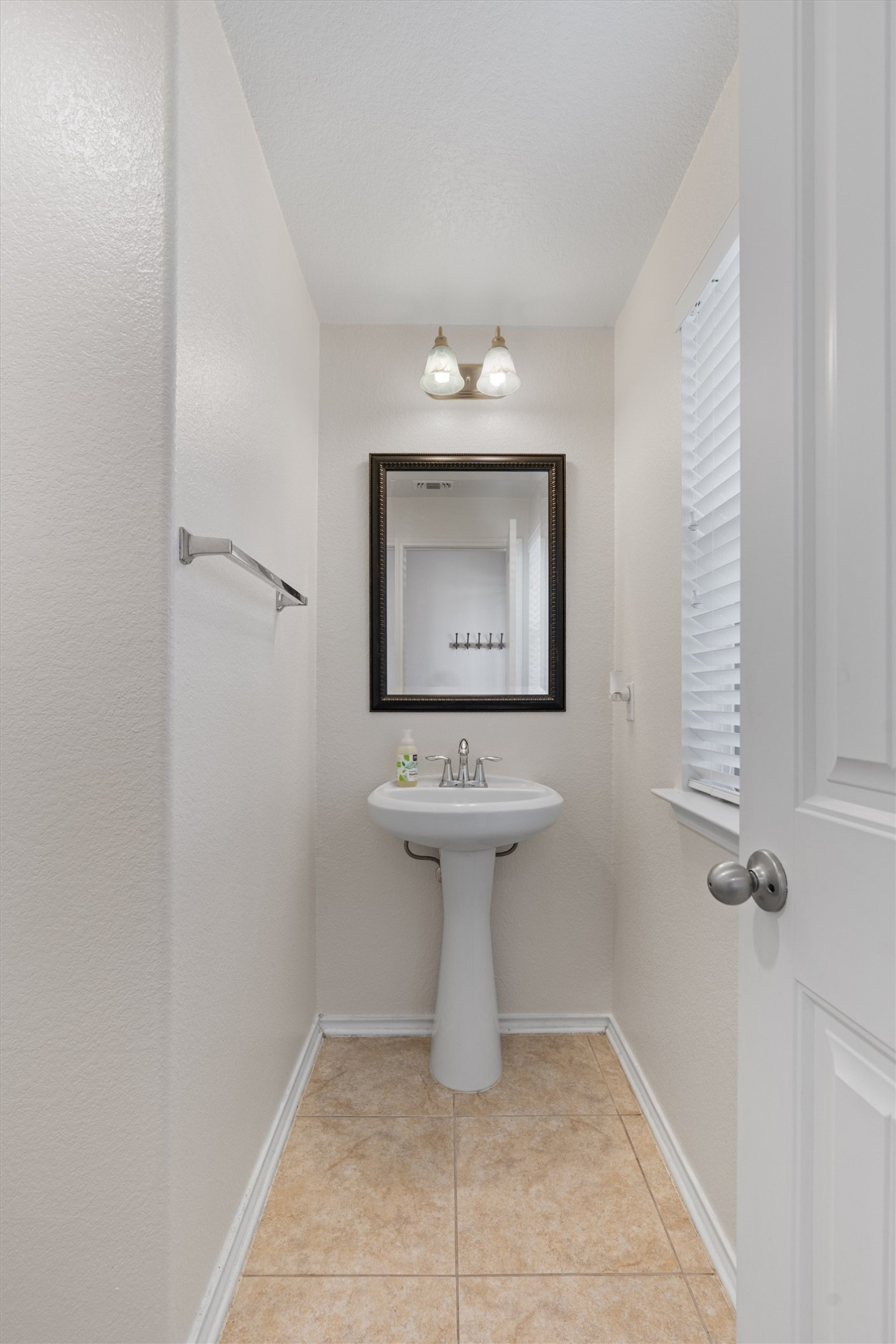 804 Water Hyacinth Loop Leander, TX 78641 - Photo 4 of 37 a bathroom with a sink toilet and a mirror