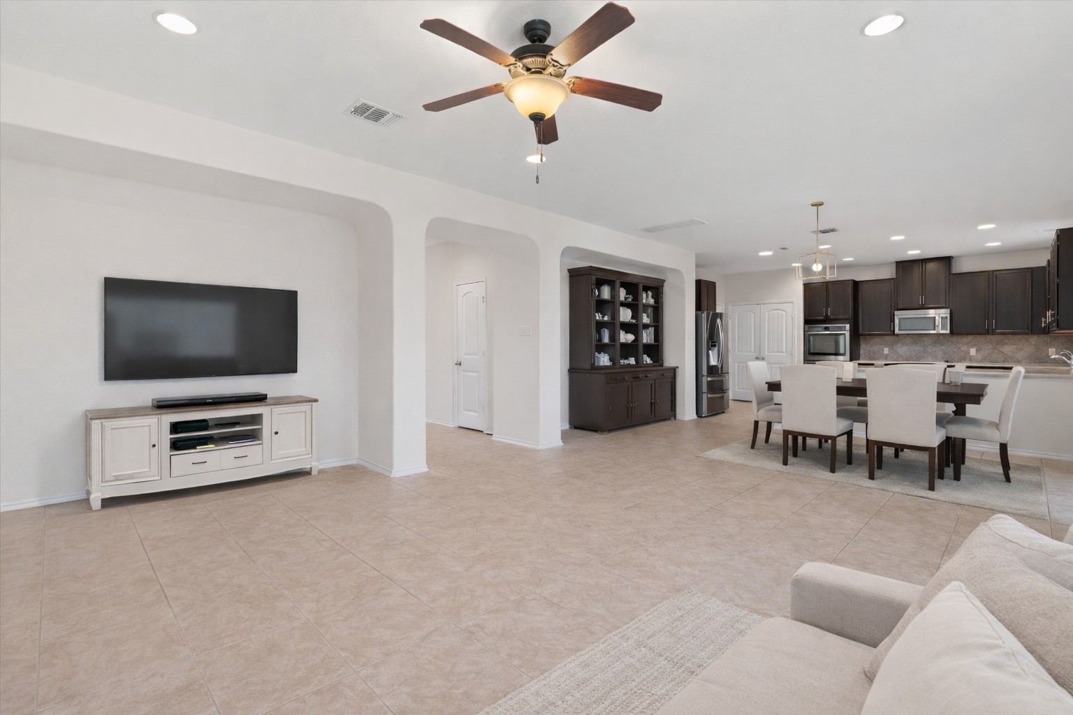 804 Water Hyacinth Loop Leander, TX 78641 - Photo 6 of 37 a living room with furniture and a flat screen tv