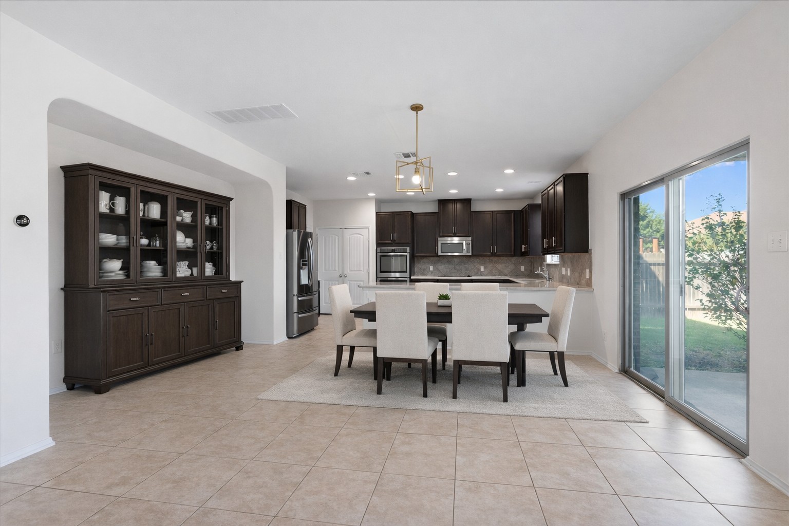 804 Water Hyacinth Loop Leander, TX 78641 - Photo 7 of 37 a view of a dining room with furniture and chandelier