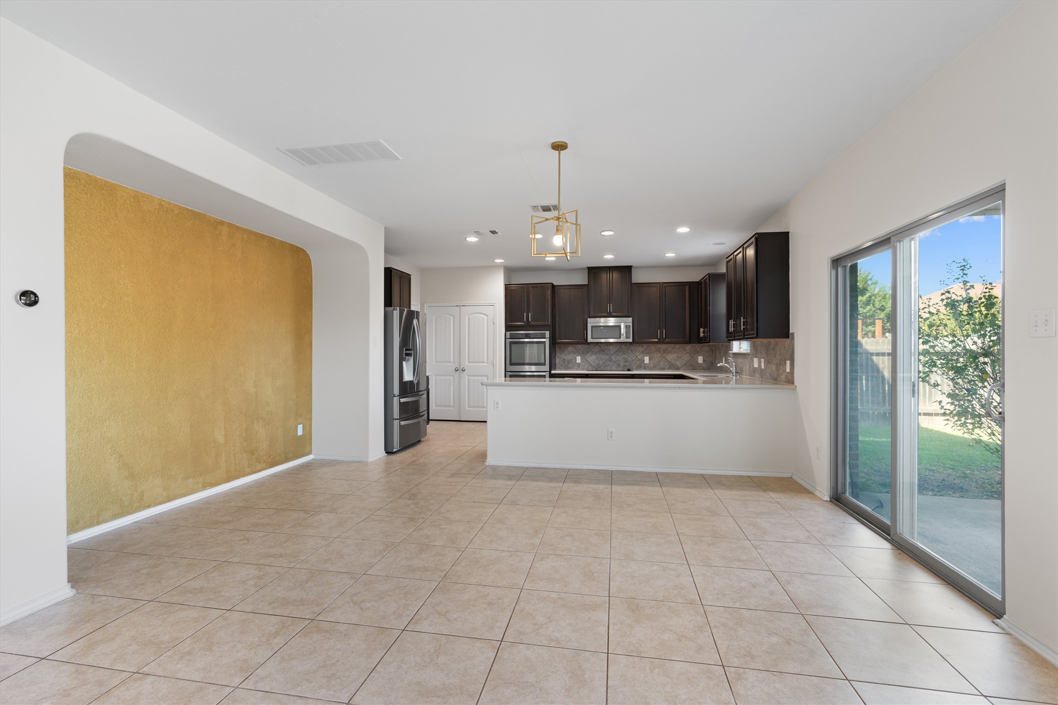 804 Water Hyacinth Loop Leander, TX 78641 - Photo 8 of 39 The adjacent dining space is perfectly positioned between the kitchen and living room, making it ideal for family meals or hosting dinner parties with ease.