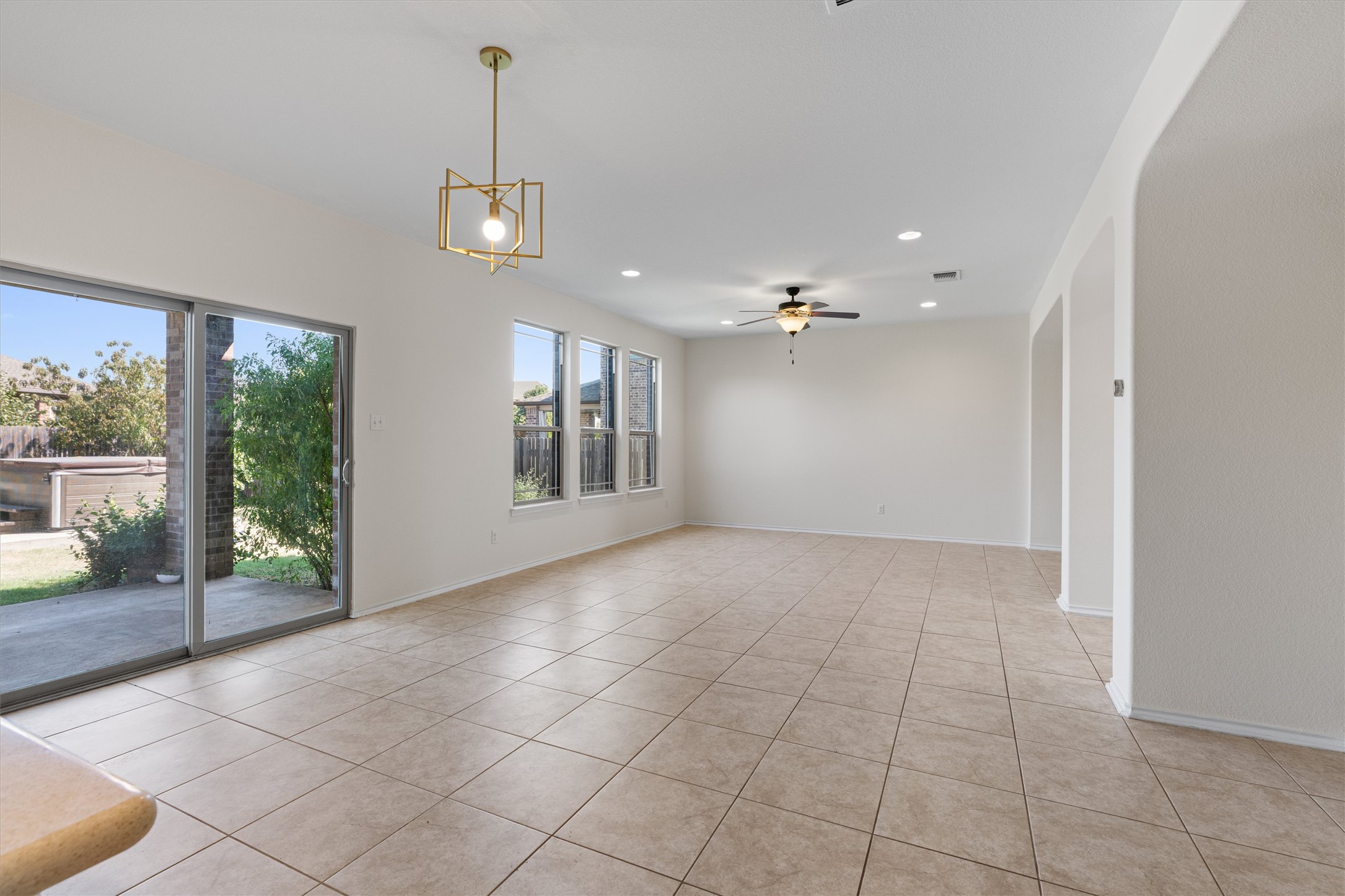 804 Water Hyacinth Loop Leander, TX 78641 - Photo 8 of 37 a view of an empty room with glass door
