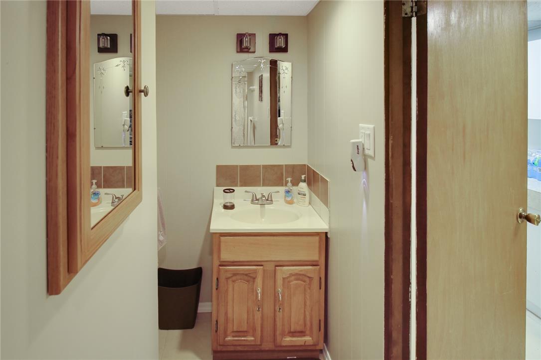 1256 Ridge Avenue Whitehall, PA 18052 - Photo 40 of 43 Functional vanity with a ceramic tile backsplash for a clean aesthetic.