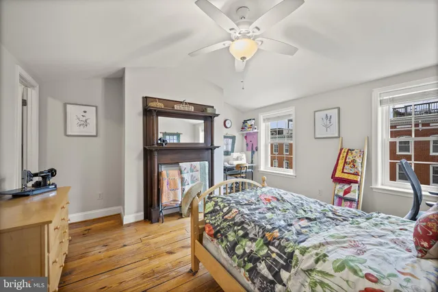 a bedroom with furniture and a window