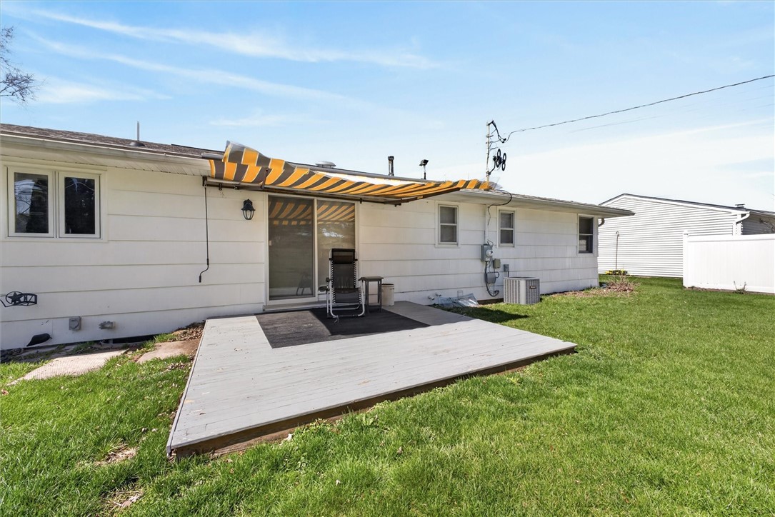 489 Chestnut Ridge Road Chili, NY 14624 - Photo 29 of 35 deck with retractavle awning