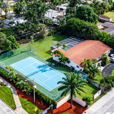 an aerial view of a pool patio and outdoor seating