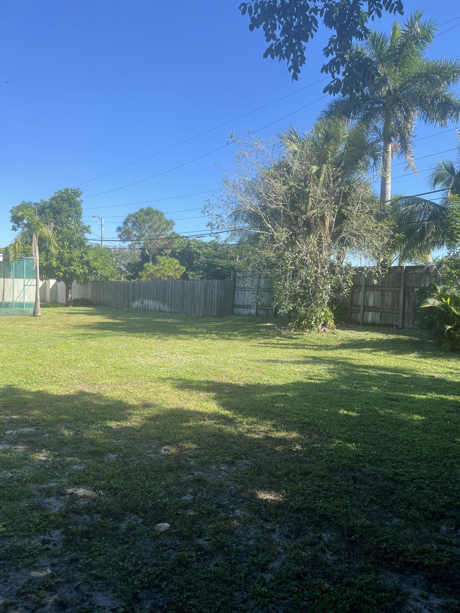 1270 Northwest 4th Avenue Boca Raton, FL 33432 - Photo 10 of 11 a view of a big yard with swimming pool and green space