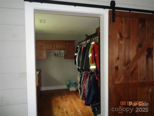 a dining room with furniture and a chandelier