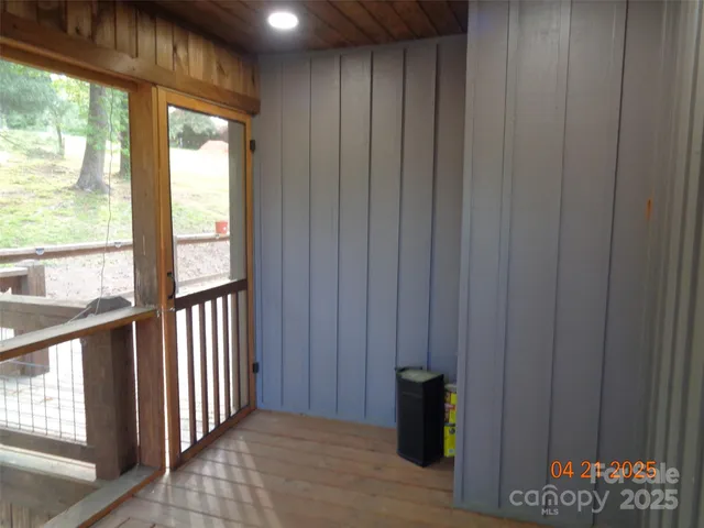 a view of balcony with wooden floor