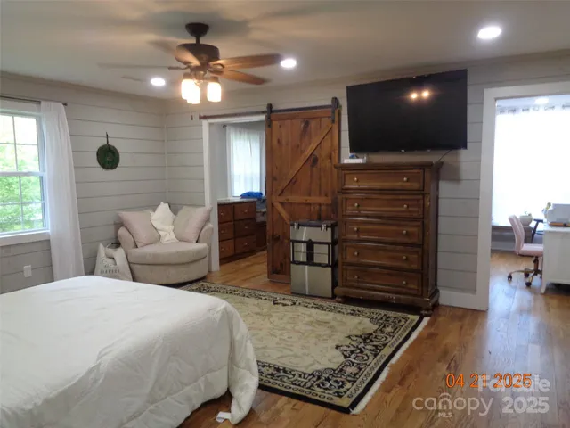 a bath tub sitting in a bathroom next to a window
