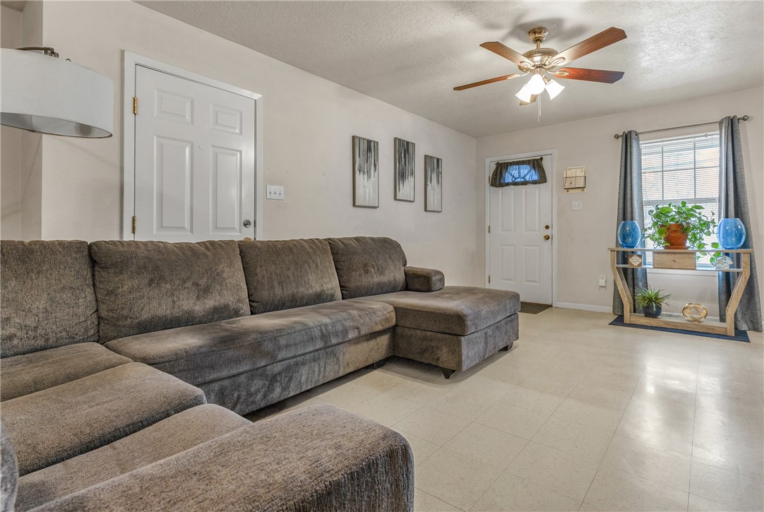 1009 West 17th Street Bryan, TX 77803 - Photo 4 of 11 a living room with furniture and a ceiling fan