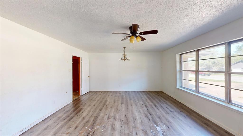 2309 Terrell Road Greenville, TX 75402 - Photo 17 of 30 a view of empty room with wooden floor and fan