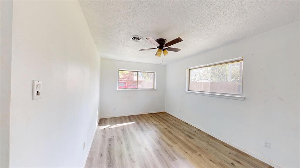 2309 Terrell Road Greenville, TX 75402 - Photo 18 of 30 a view of empty room with wooden floor