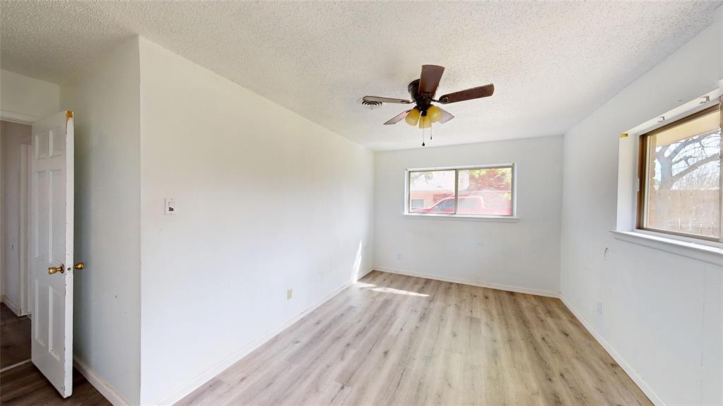 2309 Terrell Road Greenville, TX 75402 - Photo 20 of 30 a view of room with a ceiling fan and window