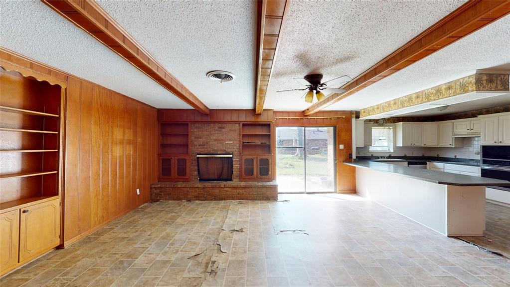 2309 Terrell Road Greenville, TX 75402 - Photo 3 of 30 a view of a kitchen with a sink and cabinets