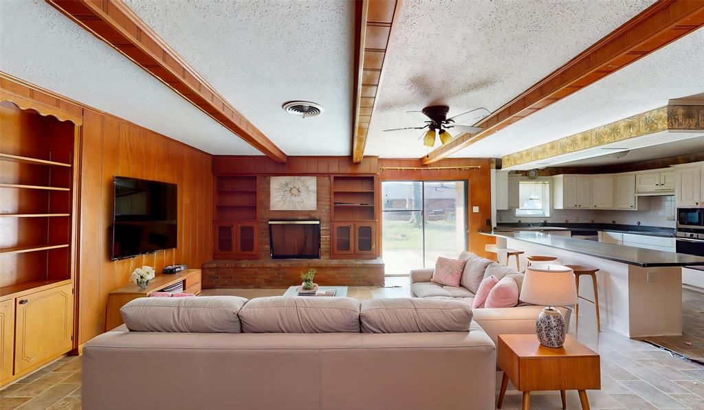 2309 Terrell Road Greenville, TX 75402 - Photo 4 of 30 a living room with furniture and a flat screen tv
