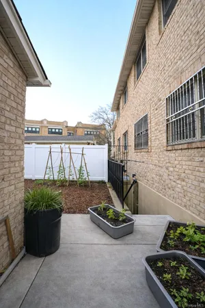 a view of a patio with table and chairs a barbeque