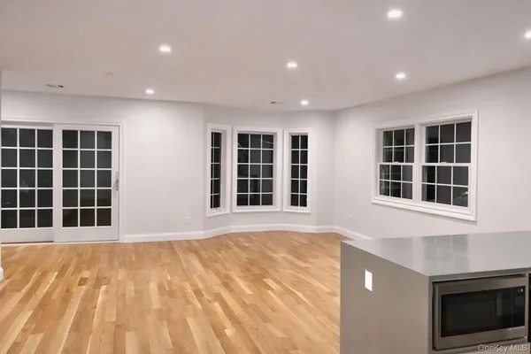 a view of empty room with windows
