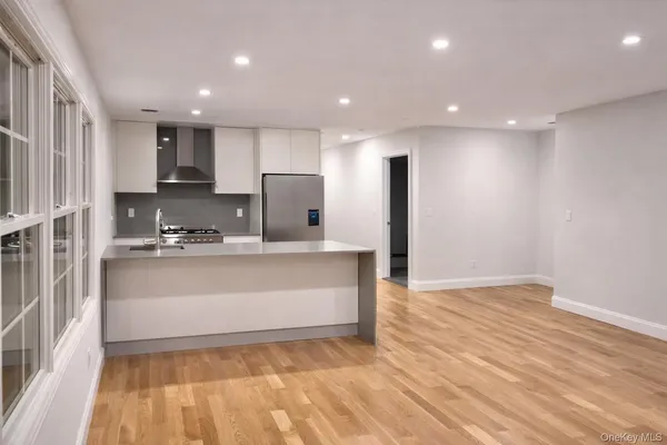 a view of kitchen with wooden floor