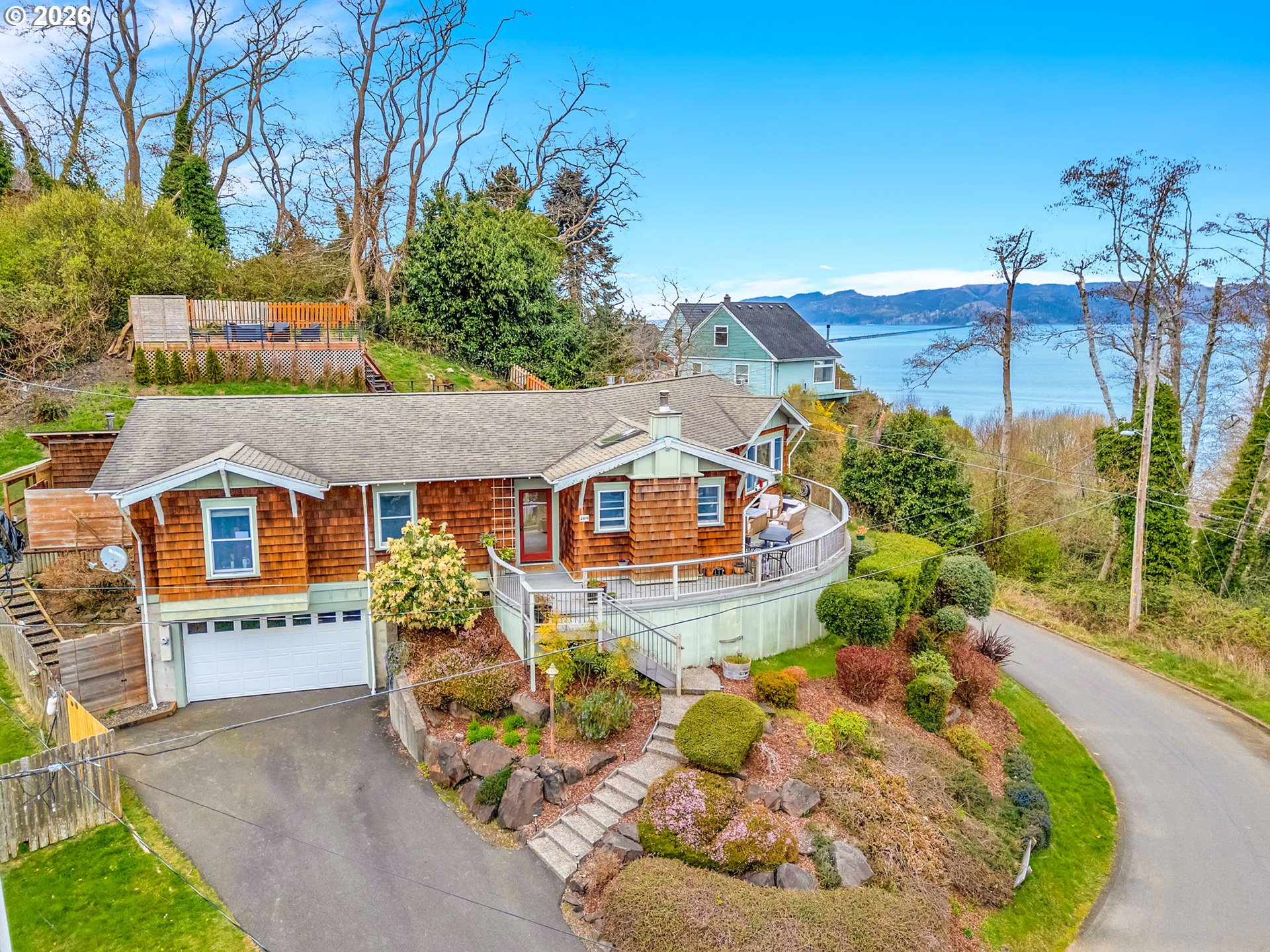 aerial view of a house with a yard and potted plants