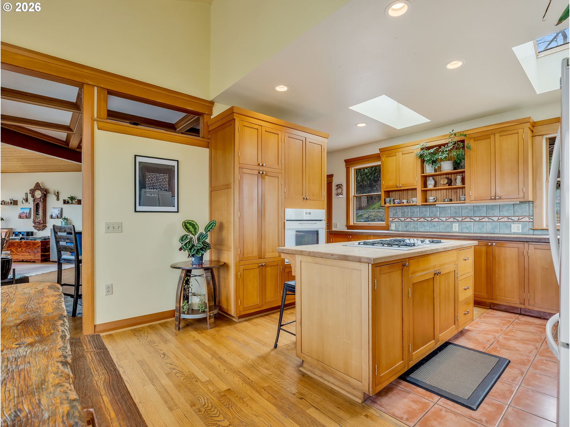 409 2nd Street Astoria, OR 97103 - Photo 11 of 45 a kitchen with stainless steel appliances granite countertop a stove a sink and a refrigerator