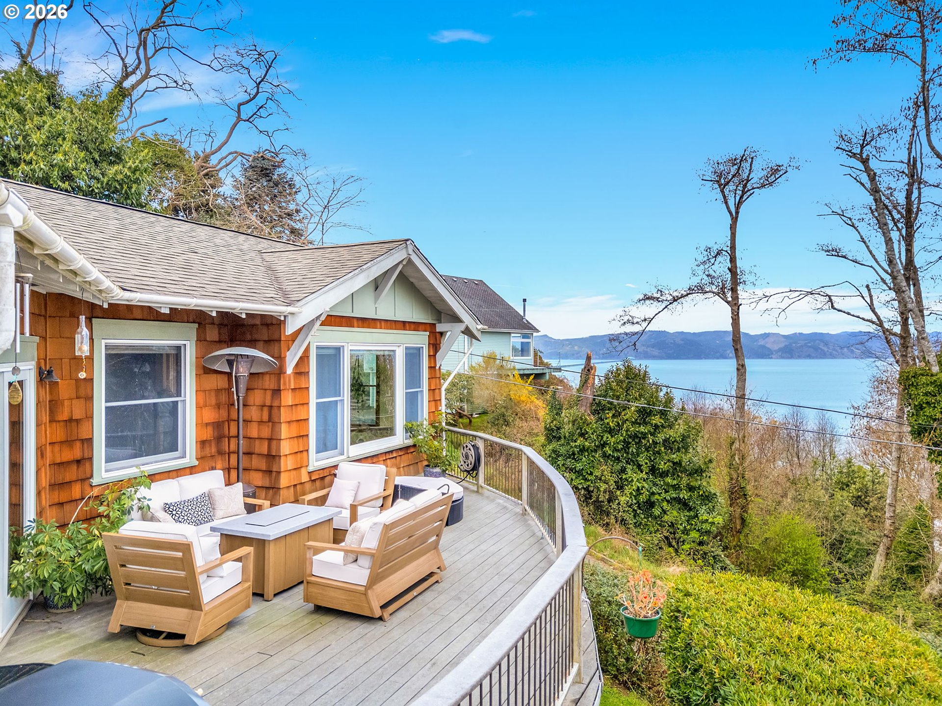 409 2nd Street Astoria, OR 97103 - Photo 2 of 45 a view of a patio with couches table and chairs and potted plants