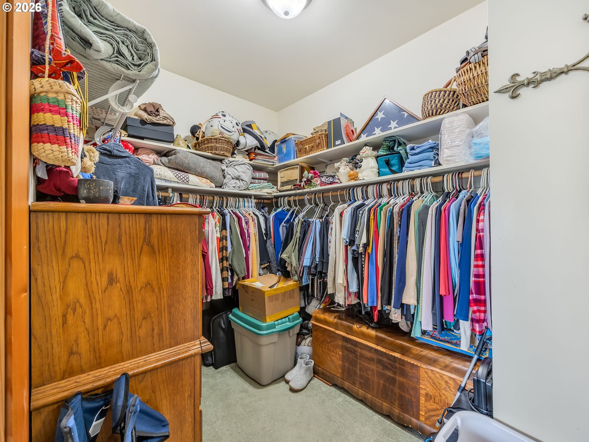 409 2nd Street Astoria, OR 97103 - Photo 22 of 45 a view of walk in closet with clothes and shoes