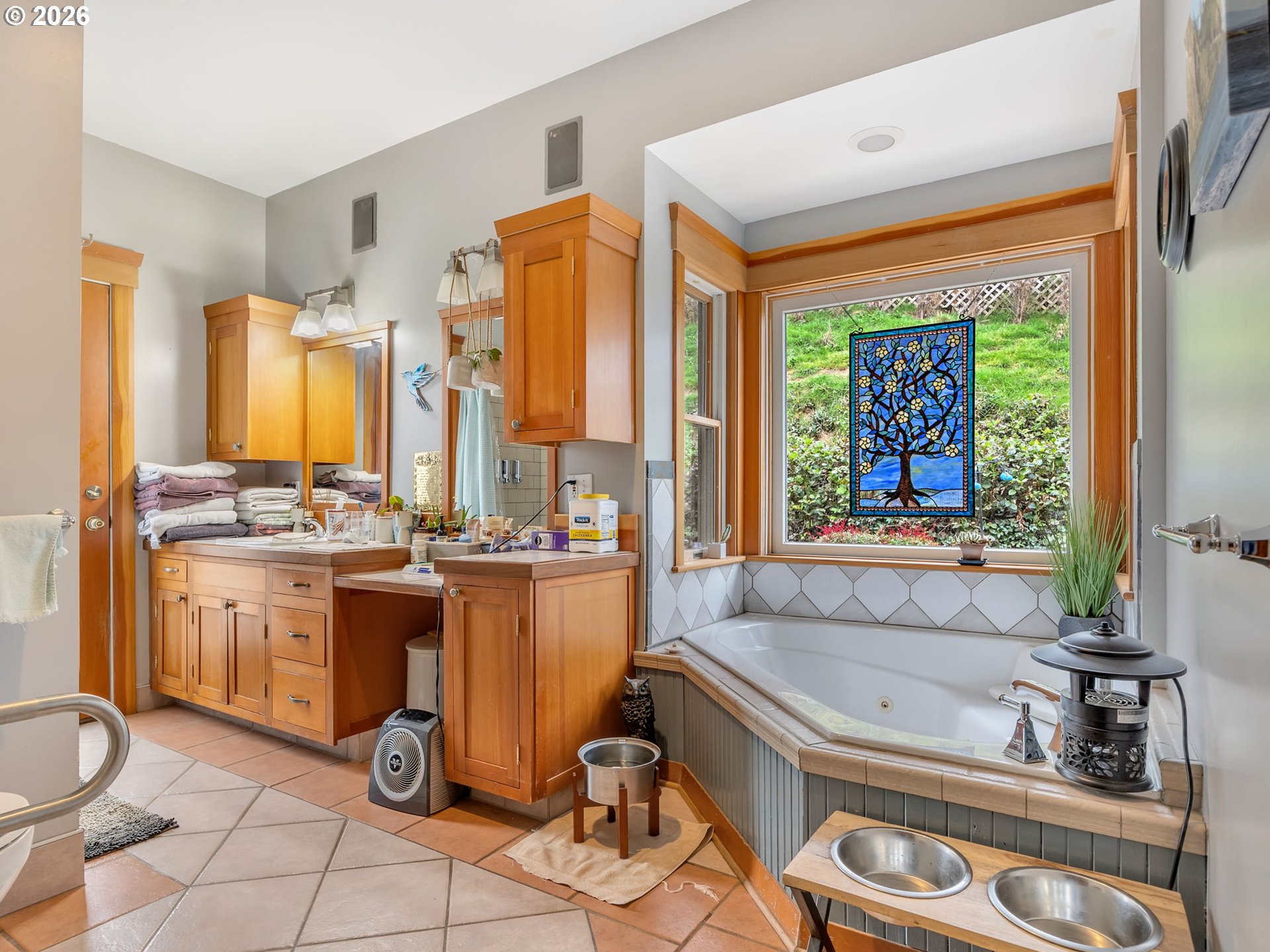 409 2nd Street Astoria, OR 97103 - Photo 23 of 45 a bathroom with a tub sink and mirror