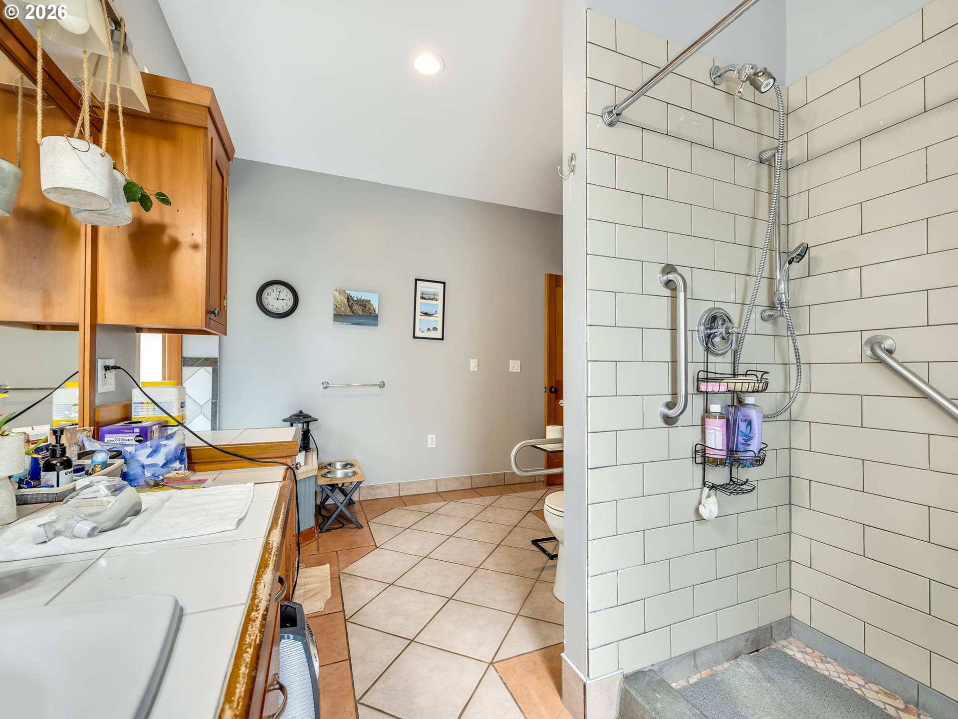 409 2nd Street Astoria, OR 97103 - Photo 24 of 45 a bathroom with a sink mirror and vanity