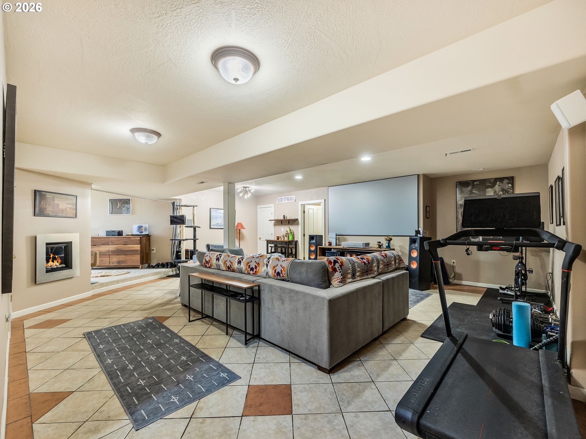 409 2nd Street Astoria, OR 97103 - Photo 30 of 45 a living room with furniture and a flat screen tv