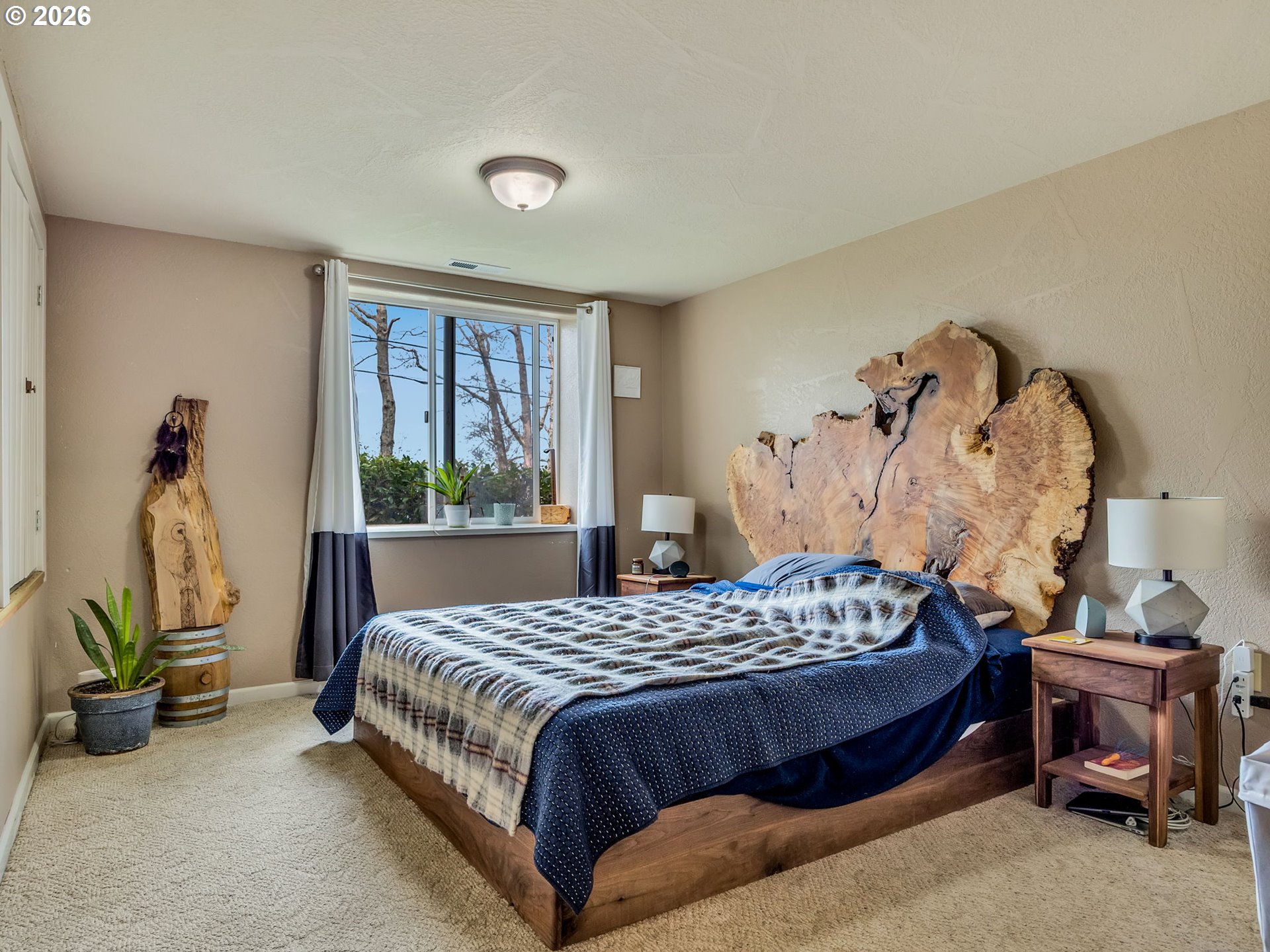 409 2nd Street Astoria, OR 97103 - Photo 32 of 45 a bedroom with a bed and a dresser