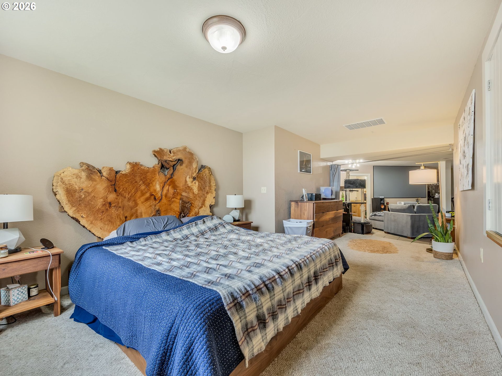 409 2nd Street Astoria, OR 97103 - Photo 34 of 45 a bedroom with a bed and a view of living room