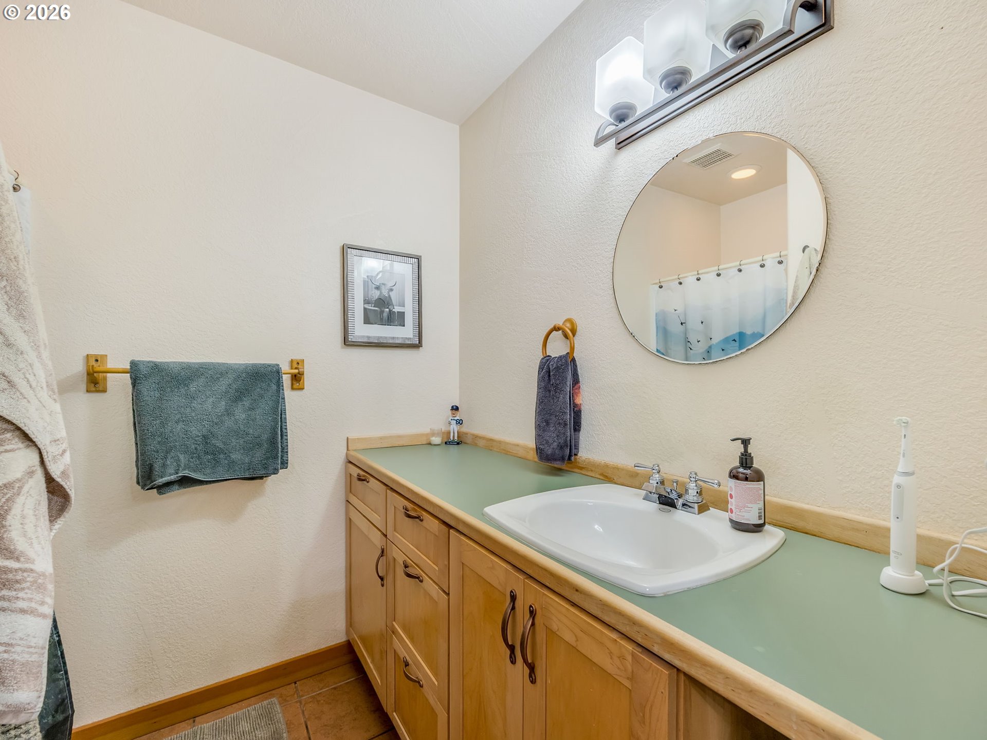 409 2nd Street Astoria, OR 97103 - Photo 35 of 45 a bathroom with a sink and mirror