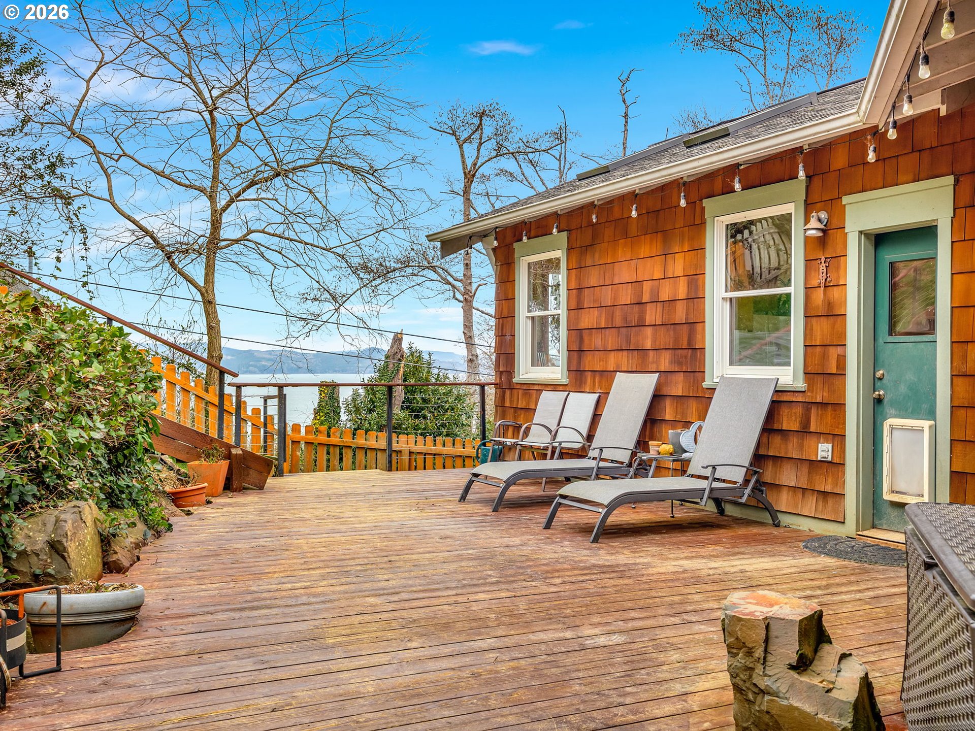 409 2nd Street Astoria, OR 97103 - Photo 42 of 45 a view of a patio with a table and chairs