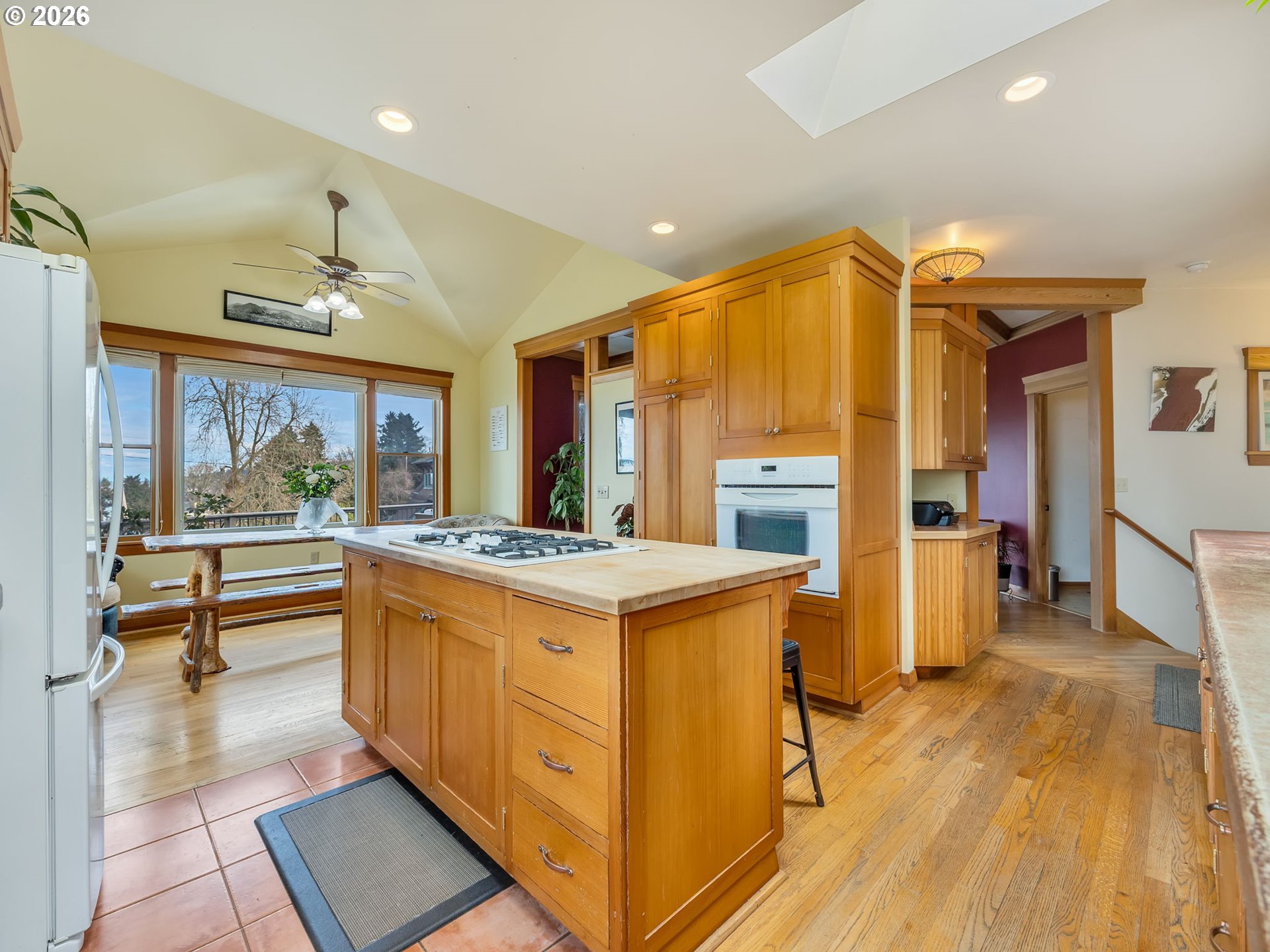 409 2nd Street Astoria, OR 97103 - Photo 9 of 45 a view of kitchen with kitchen island wooden floors and stainless steel appliances