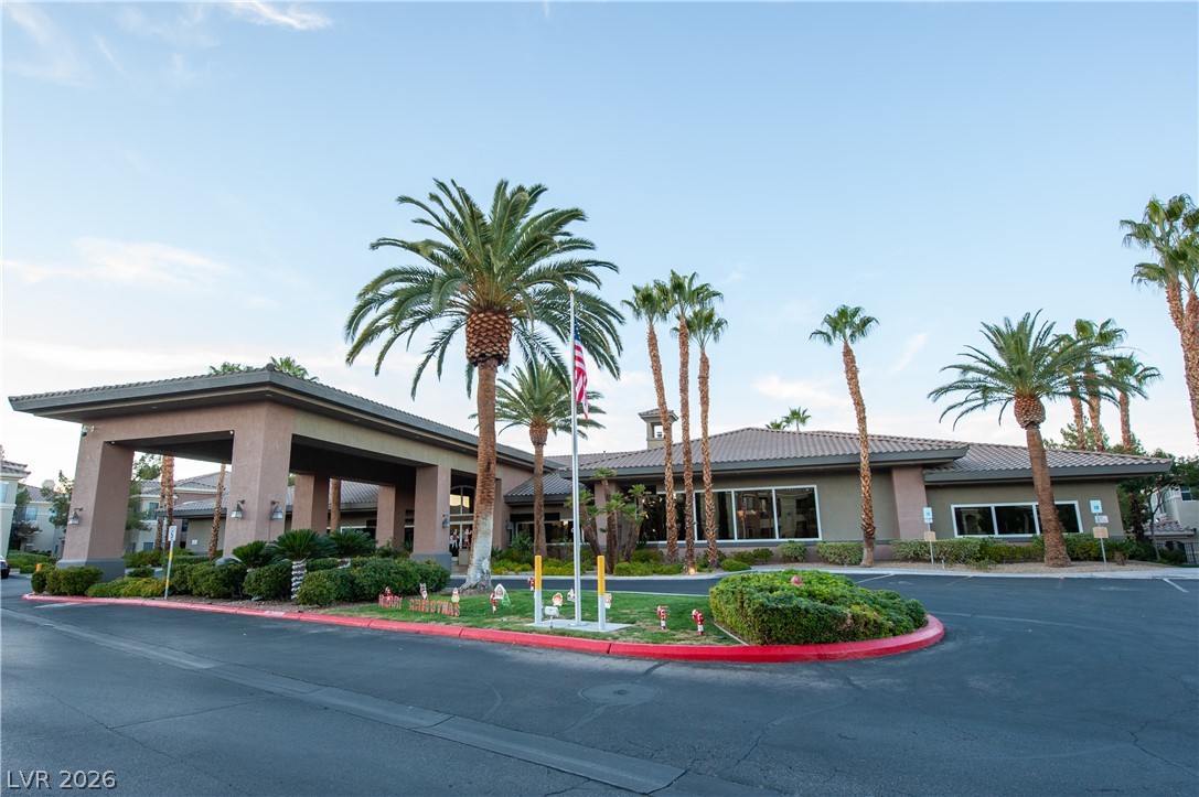 9050 West Warm Springs Road, Unit 1132 Las Vegas, NV 89148 - Photo 2 of 21 A graceful entry with lush plantings welcomes visitors to this well-appointed community building.