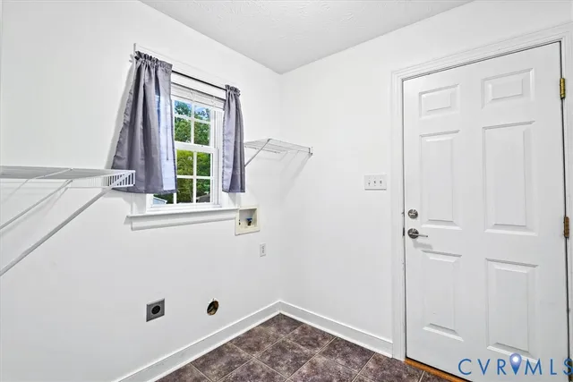 a view of room with window and hallway