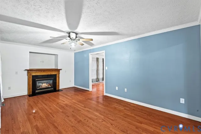 wooden floor fireplace and windows in a room
