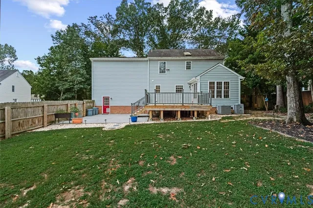 a front view of house with yard and trees