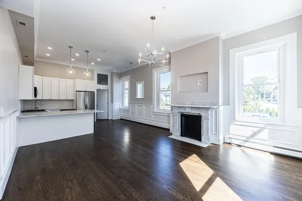 a view of kitchen with furniture and fireplace