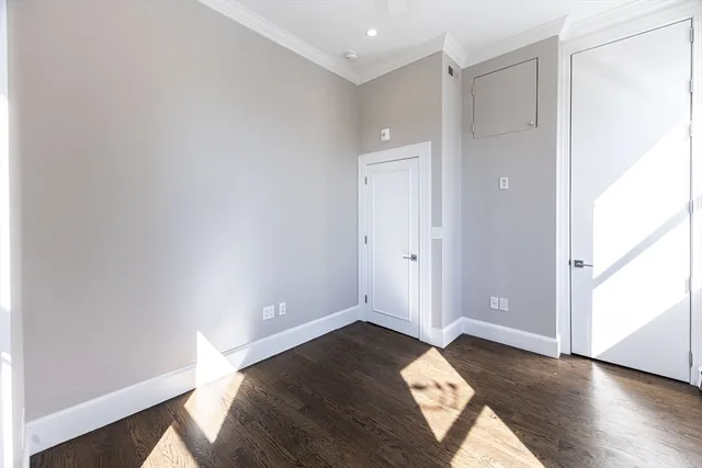 an empty room with wooden floor