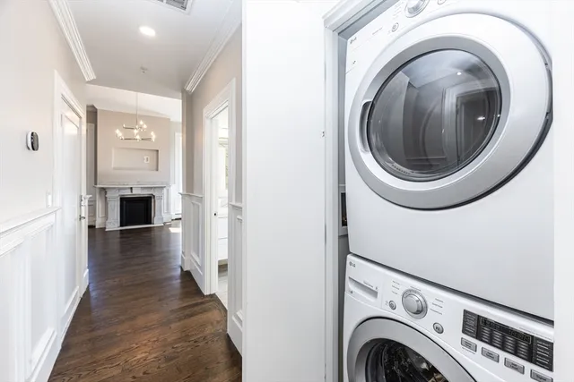 a view of a hallway with washer and dryer