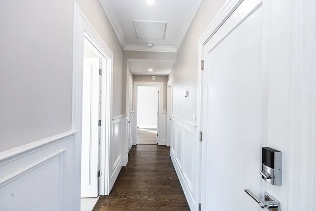 a view of a hallway with a wooden floor