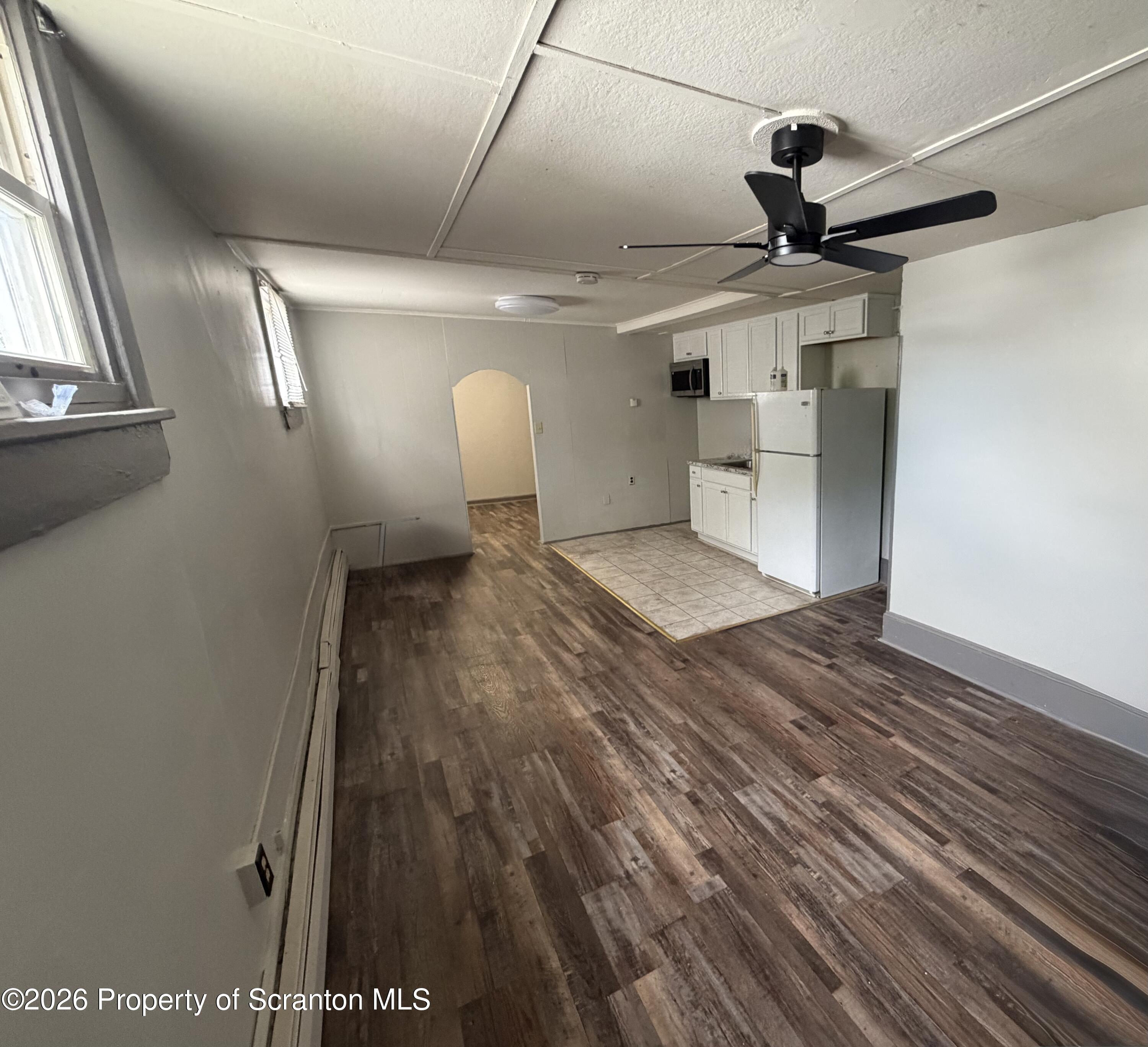 130 State Street, Unit 1 Nanticoke, PA 18634 - Photo 2 of 7 a view of a livingroom with wooden floor