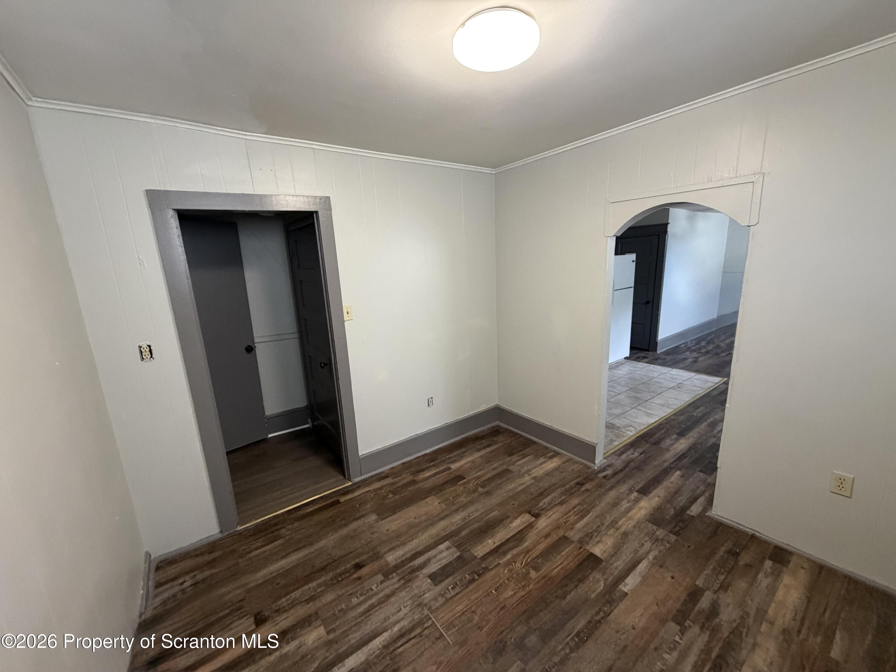 130 State Street, Unit 1 Nanticoke, PA 18634 - Photo 5 of 7 a view of a hallway with wooden floor