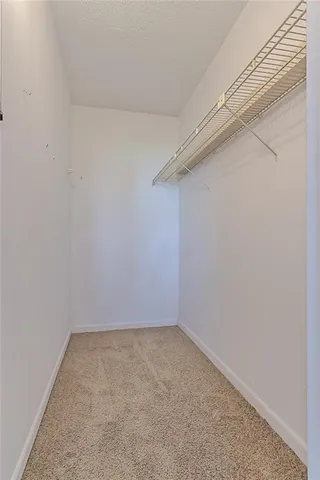 a bathroom with a sink toilet vanity and shower
