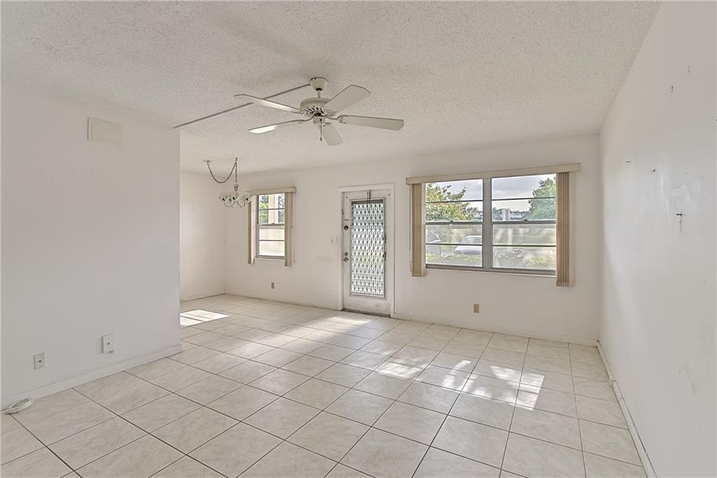 167 Grantham East, Unit 167 Deerfield Beach, FL 33442 - Photo 4 of 20 a view of an empty room with a window