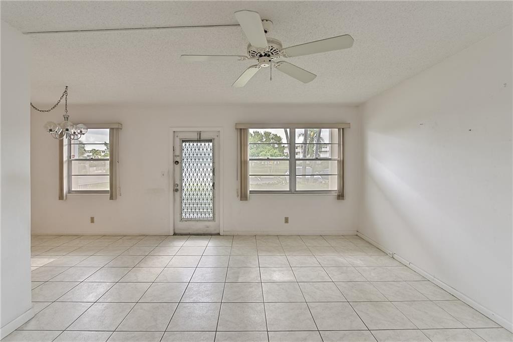 167 Grantham East, Unit 167 Deerfield Beach, FL 33442 - Photo 5 of 20 a view of an empty room with a window